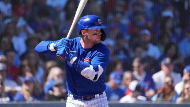Mar 4, 2023; Mesa, Arizona, USA; Chicago Cubs shortstop Nico Hoerner (2) bats against the Los Angeles Angels during the first inning at Sloan Park. Mandatory Credit: Joe Camporeale-USA TODAY Sports